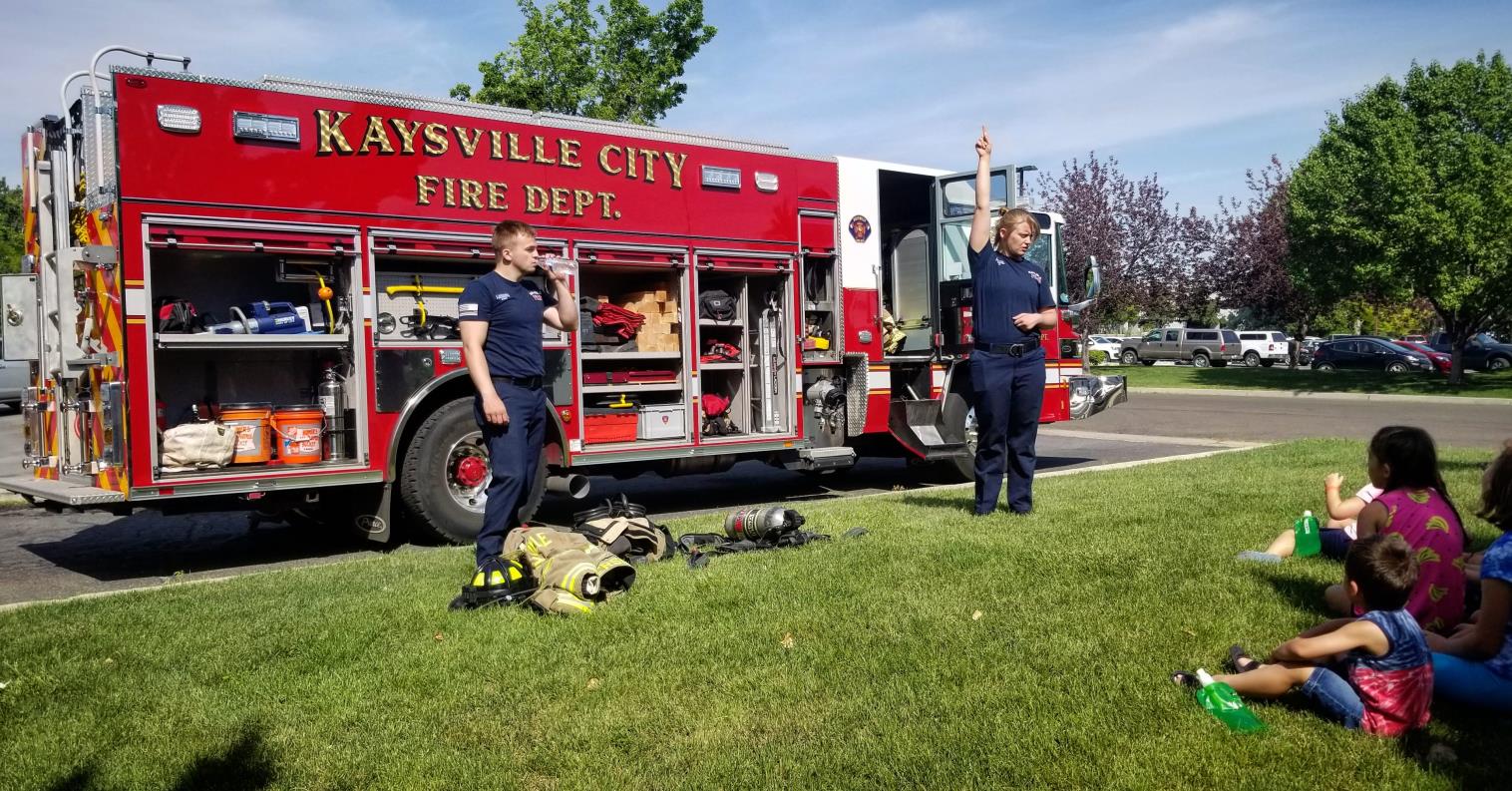 Firefighters presenting a safety message to kindergartners